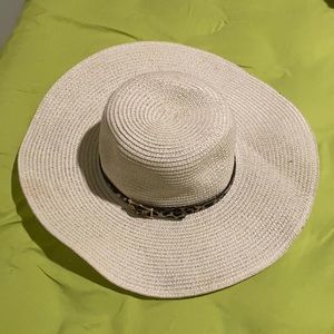 Large brim floppy straw hat with animal tie. Worn once it twice.